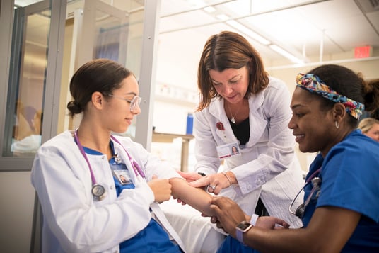 Nursing students with teacher