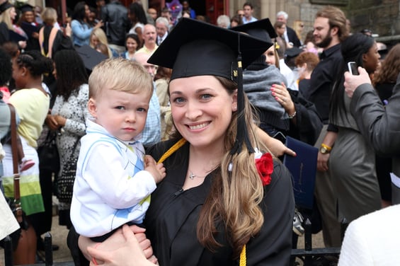 Graduation, woman with child