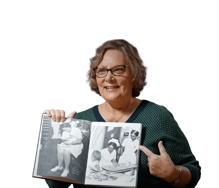 nurse-pointing-at-book@2x-1-1
