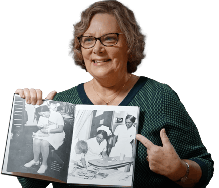nurse-pointing-at-book@2x