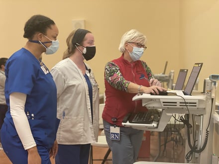 Carney COVID Clinic - Students with RN. Photo credit: Carney Hospital.