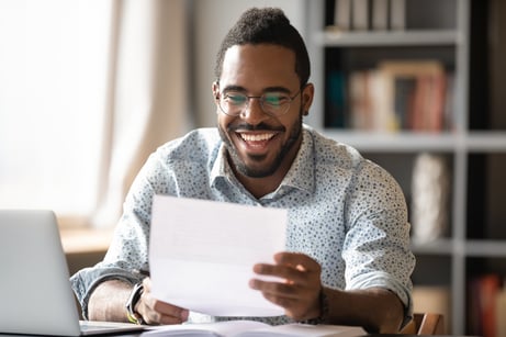 Cheerful-african-american-male-entrepreneur-read-great-news-in-letter-1203044172_6720x4480