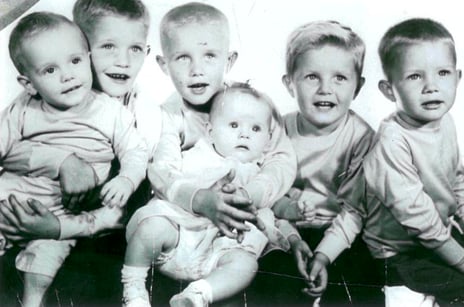 Carole Doherty's six children pose for a black and white portrait from the 1970s