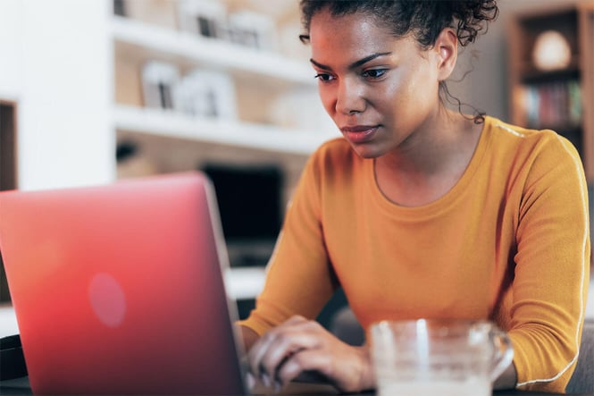 girl-typing-on-a-red-laptop-optimized