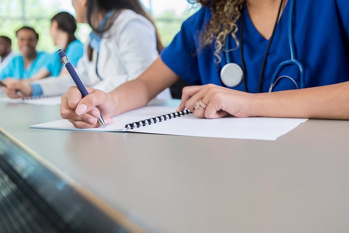 how-long-is-nursing-school-medical-student-writes-in-class-workbook